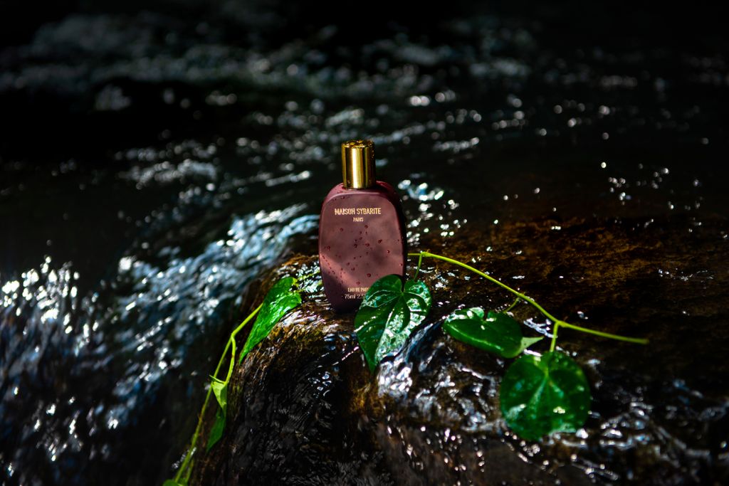 Maison Sybarite perfume bottle washed by water