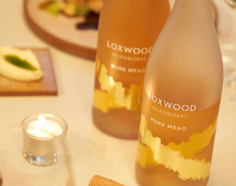 Bottles of Loxwood Meadworks Pure Mead on table