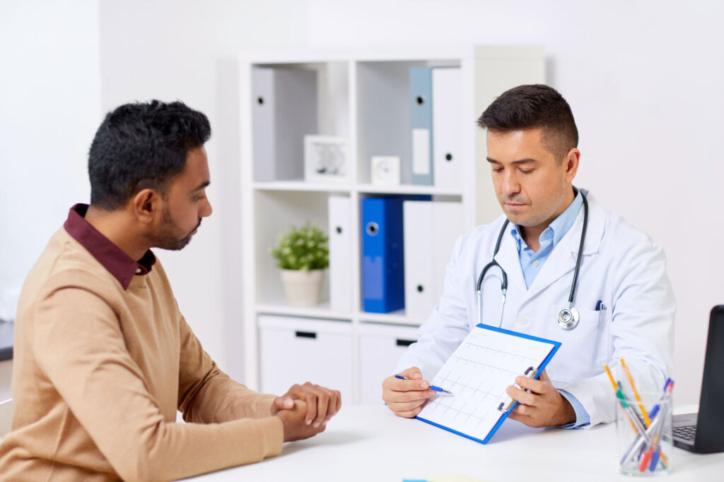 A patient talking to his doctor in the clinic