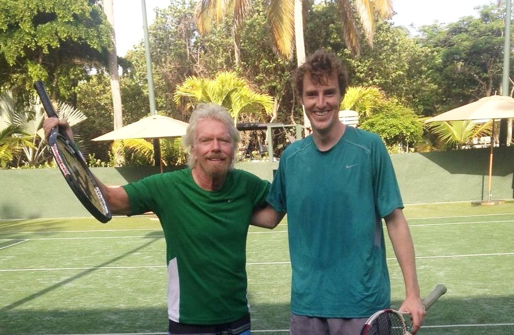 Richard Branson taking tennis lessons from James Cluskey