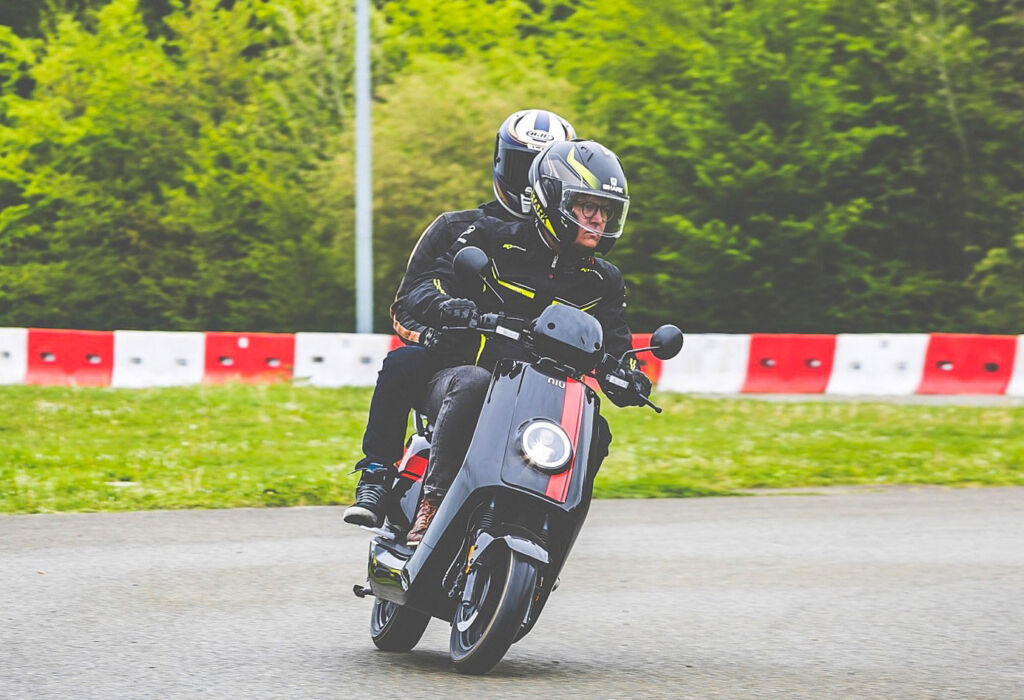 Rider and passenger on the NQi GTS Sport