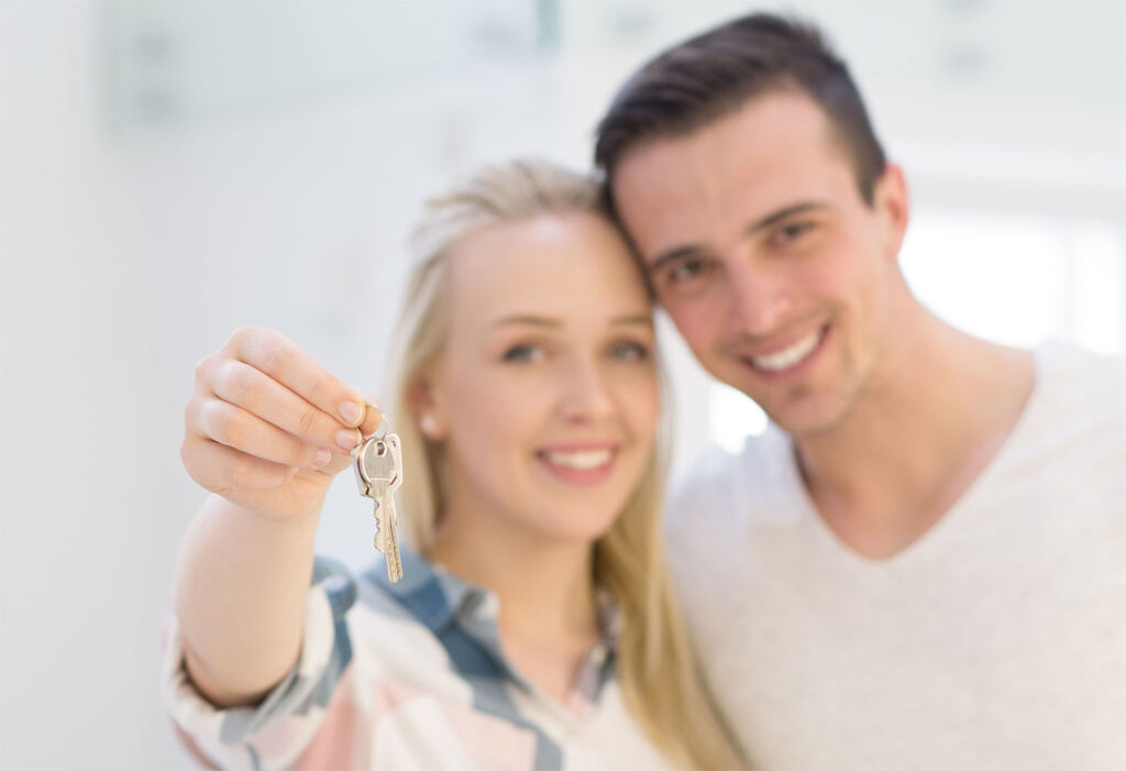 Couple viewing a property on an open house day