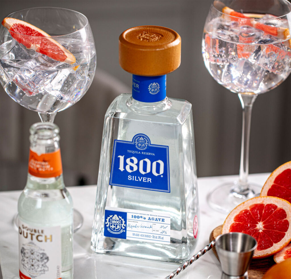 1800® Tequila bottle and fruit filled glasses