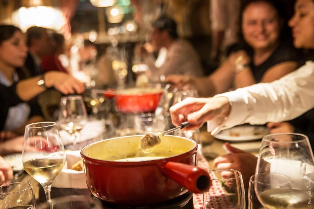 Swiss nationals enjoying a delicious fondue