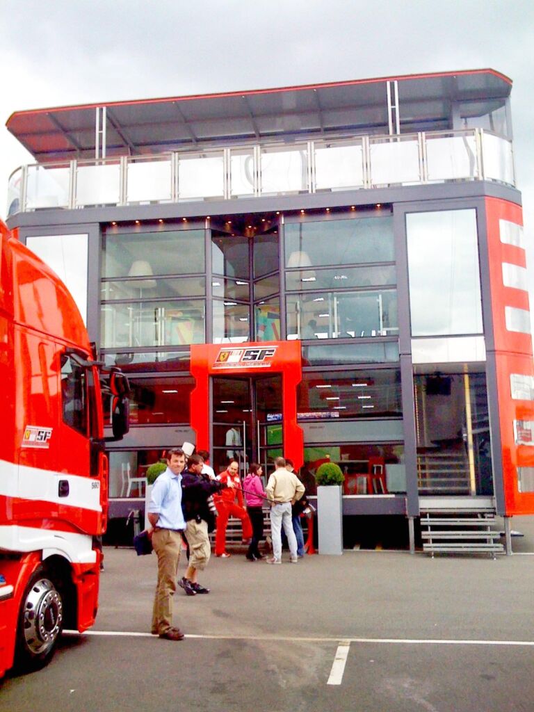 An F1 hospitality centre with people waiting to get inside