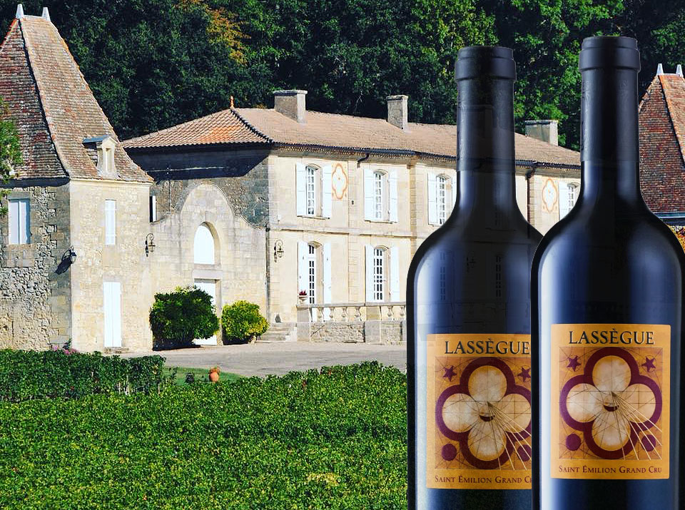 A couple of bottles of Château Lassègue, Saint-Émilion Grand Cru, 2012 outside the main vineyard property