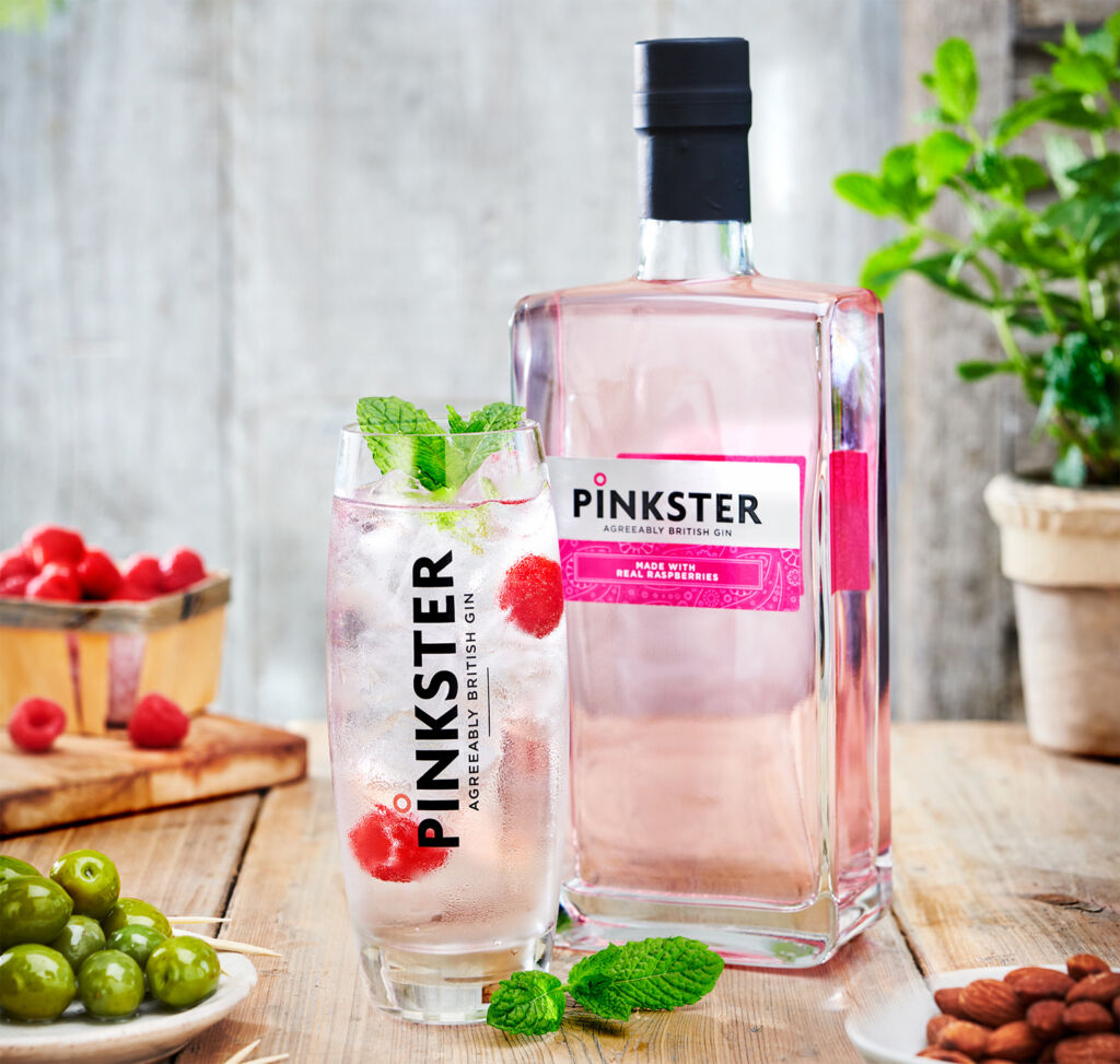 A bottle of Pinkster Gin with a glass filled to the brim