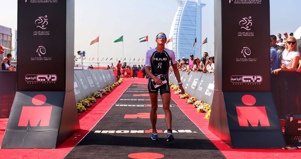 Helen Jenkins MBE crossing the Ironman Dubai finishing line
