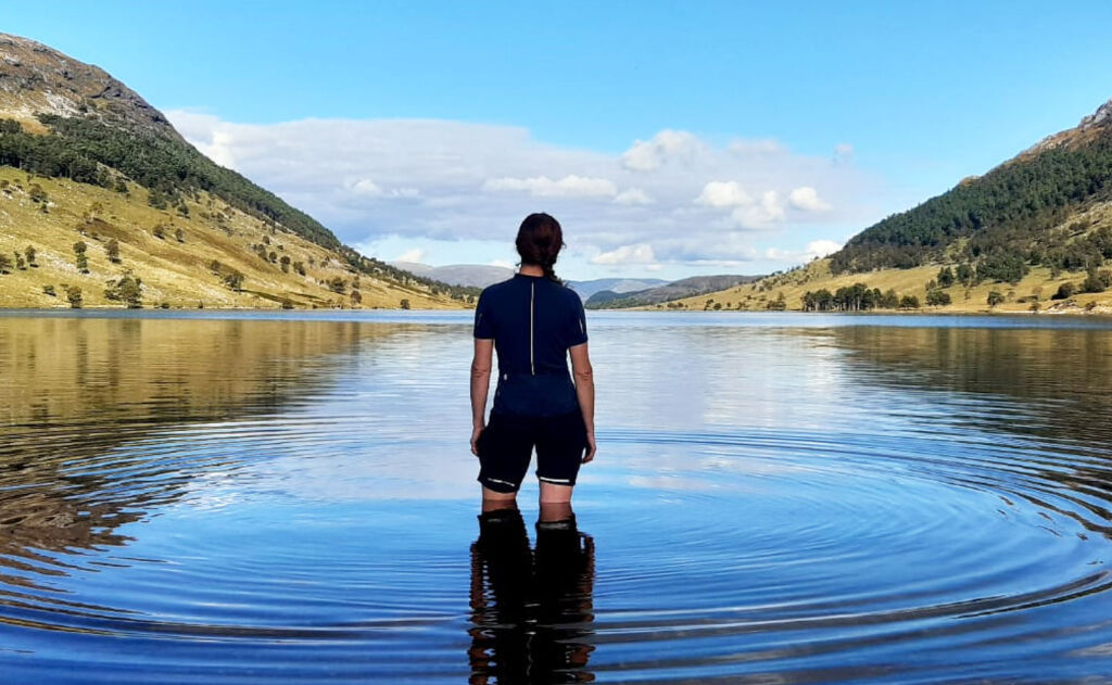 Natalie Creswick stood in a lake pondering the future of womens cycling