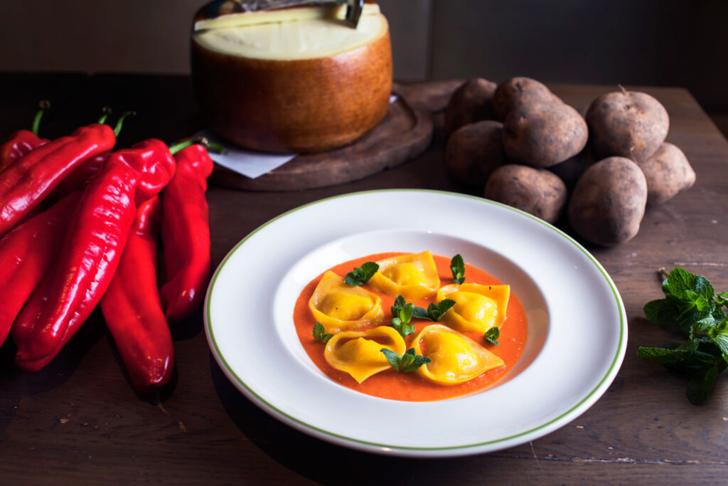 Tortelli with potato, mint and red peppers Passata