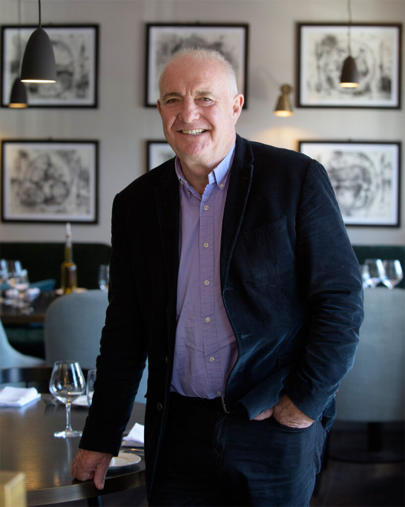 Rick Stein in casual attire in one of his restaurants