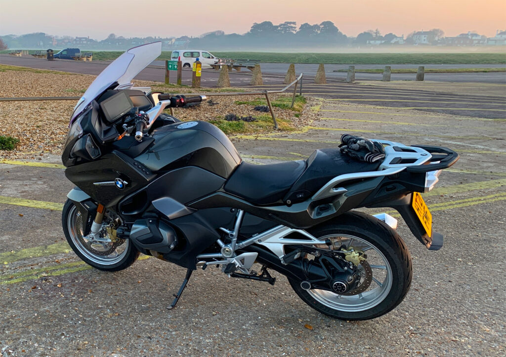 2021 BMW R 1250 RT parked on the beachfront as the sun sets