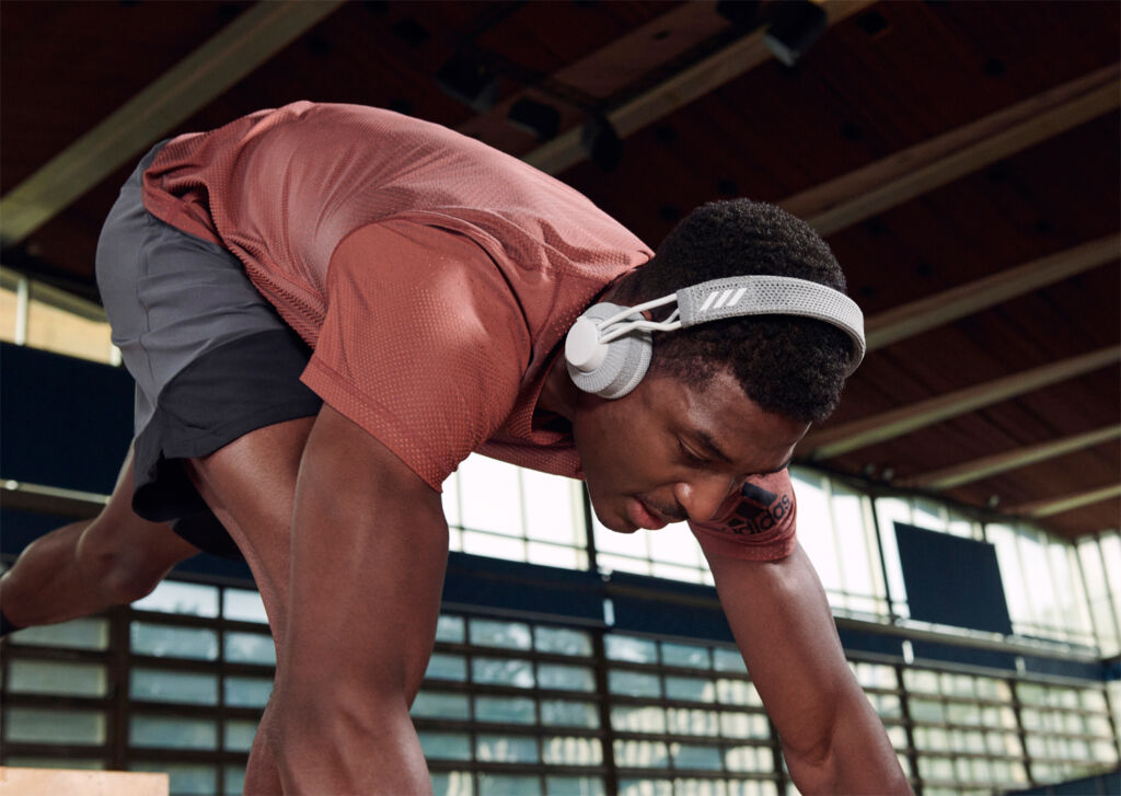A man using the headphones during a vigorous workout