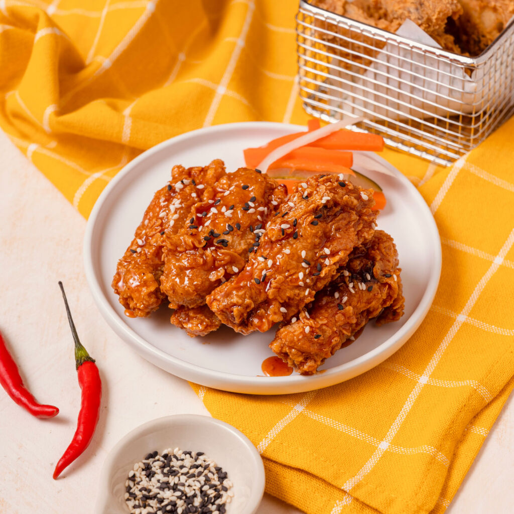 A plate stacked high with K-Pop crispy chicken