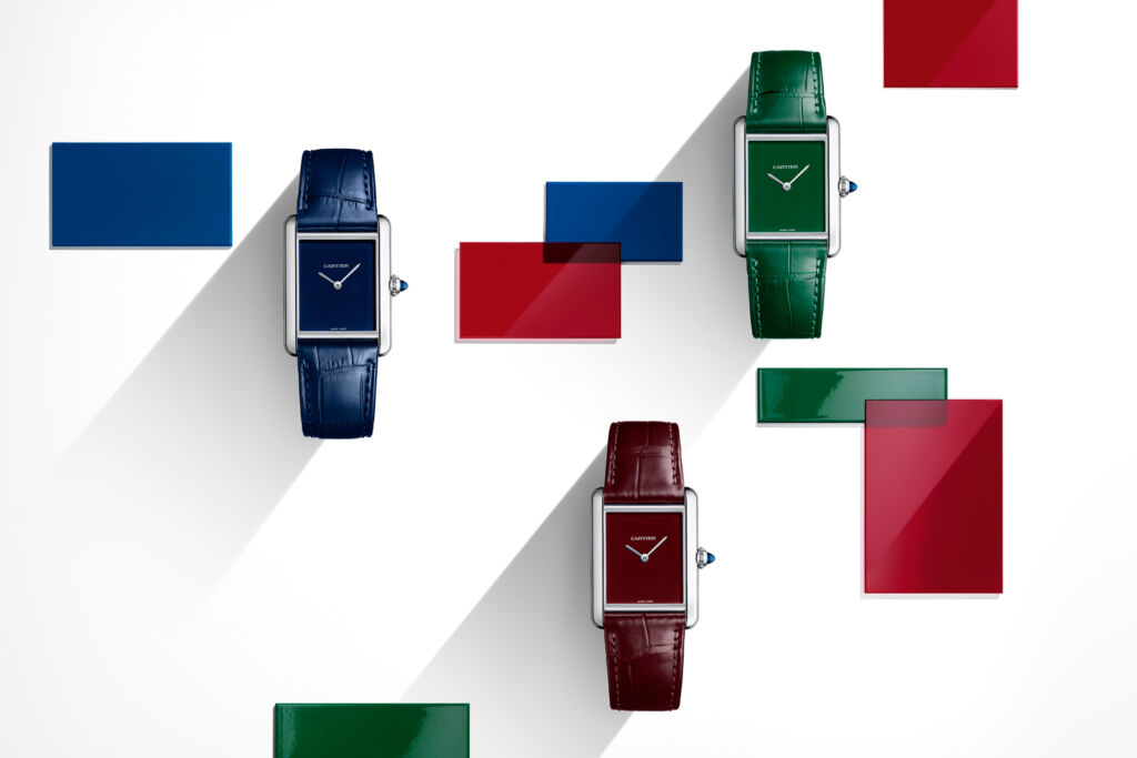 The red, blue and green strapped models that represents the brand's DNA