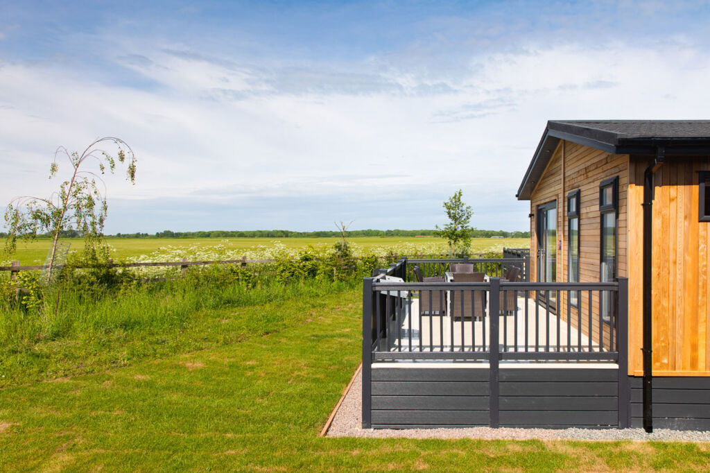 One of the lodges set next to the open countryside which provides spectacular views