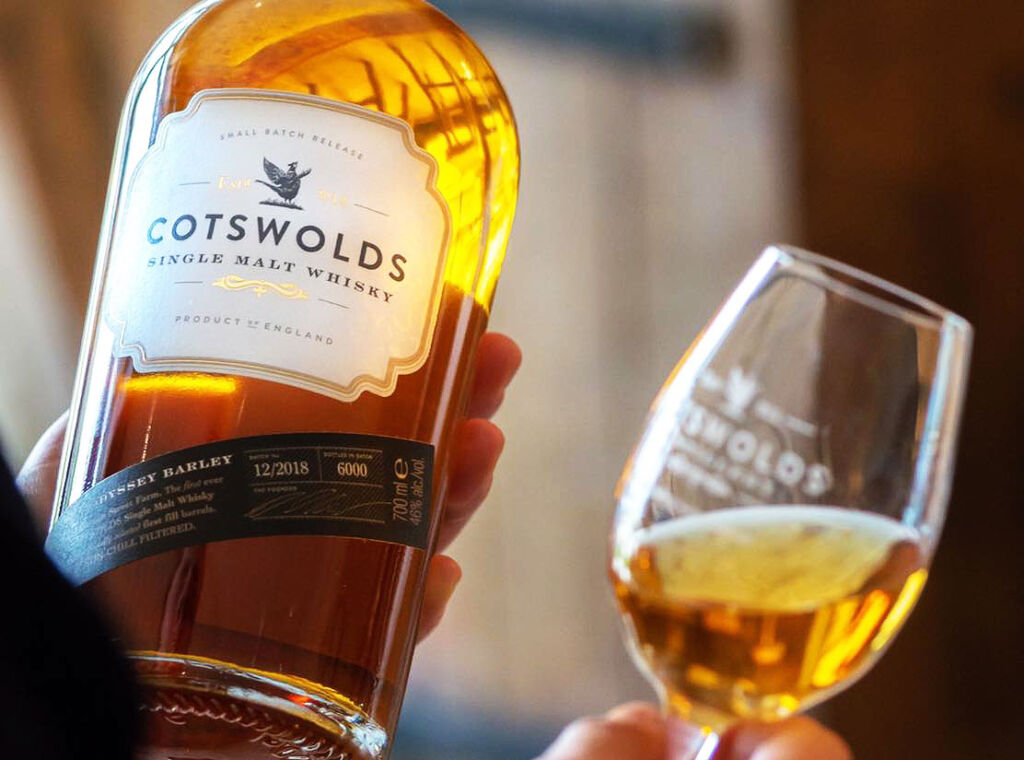 Examining a bottle of Cotswolds Single Malt Whisky