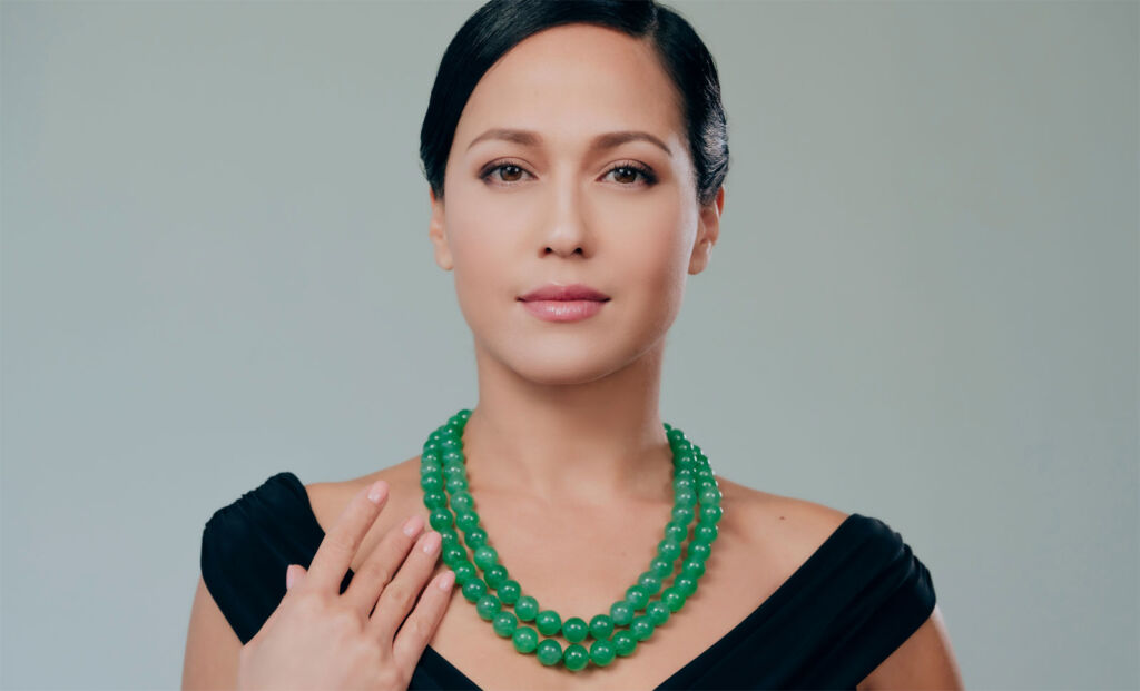 A model wearing the Jadeite and Diamond Necklace