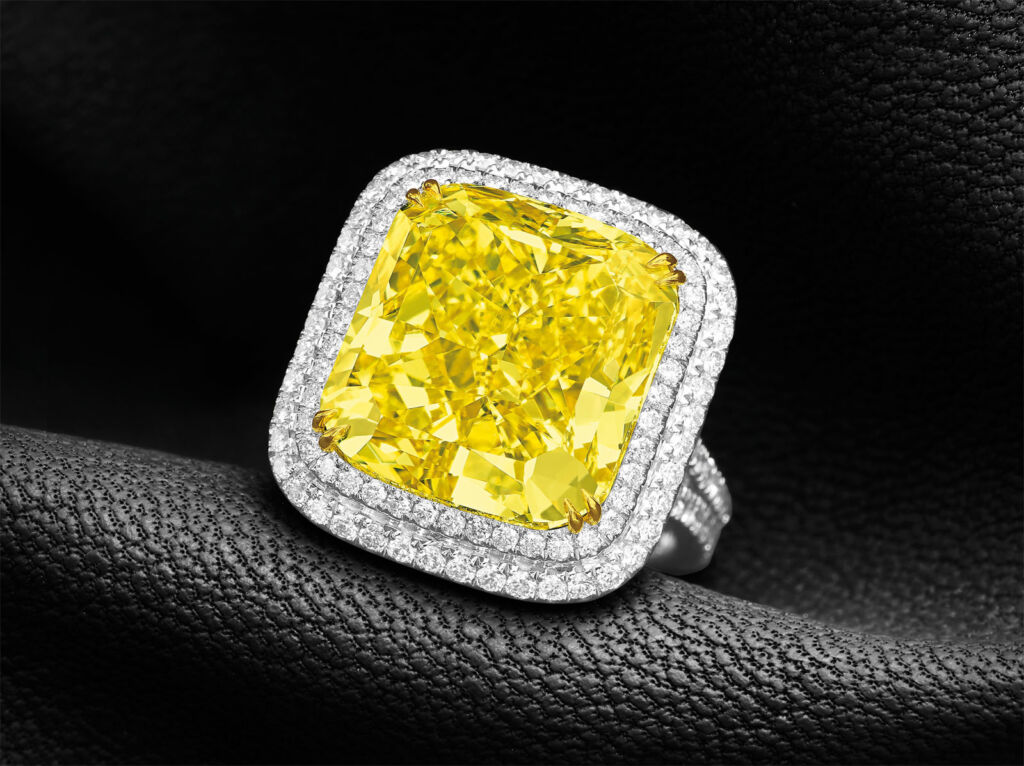 A close up view of the Natural Fancy Vivid Yellow VS1 Clarity Diamond Ring (lot 99)