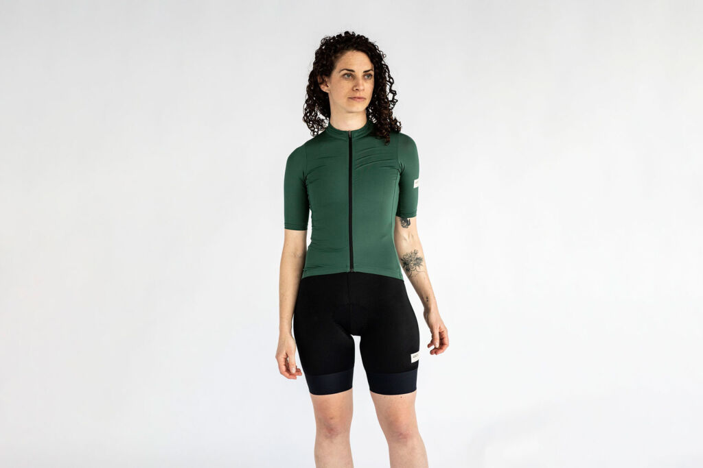 Female model wearing the short sleeve Jersey in Forest Green colour