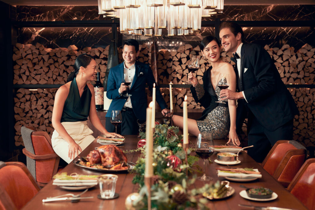 Two couples celebrating the festive period at Rosewood Hong Kong