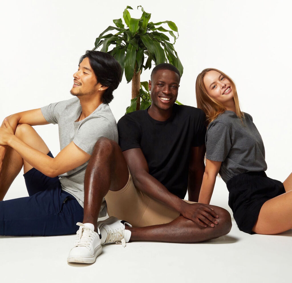 Two male and one female model wearing the brands sustainable clothing
