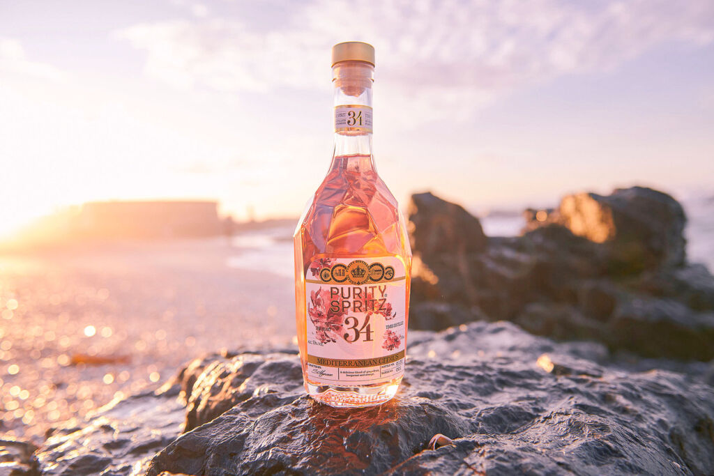 A Bottle of Purity Spritz 34 at the beach