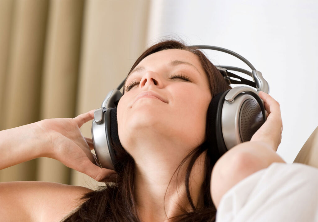 A young woman relaxing while listening to music