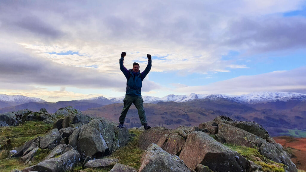 Paul celebrating on top of a mountain in the Berghaus Expeditor Ridge 2.0 Boots