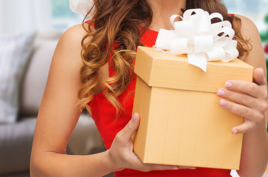 A woman giving an eco-friendly Christmas gift