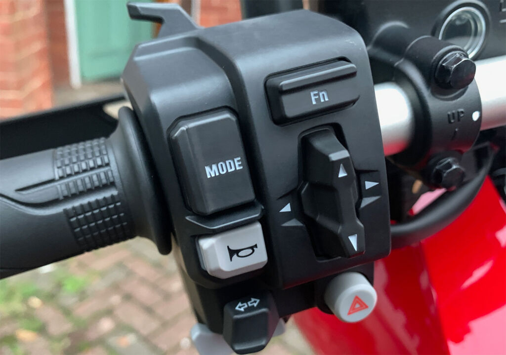 A close-up view of the button layout on the left handlebar