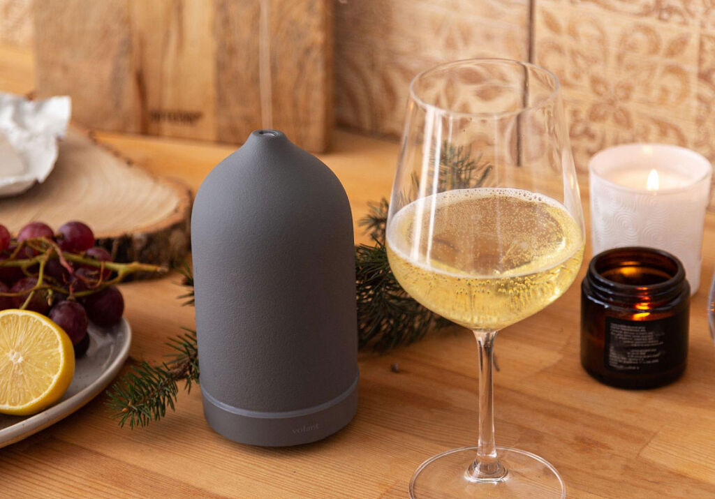 The brand's diffuser next to a glass of festive bubbly