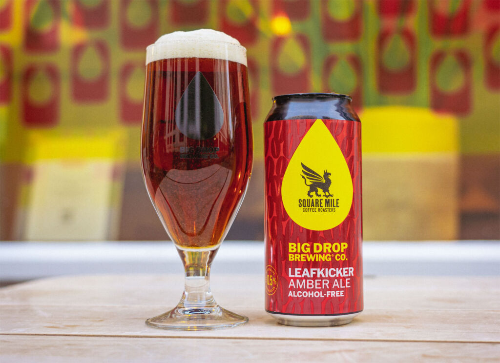 A can and filled glass of Big Drop Brewing Co Leafkicker alcohol-free Amber Ale