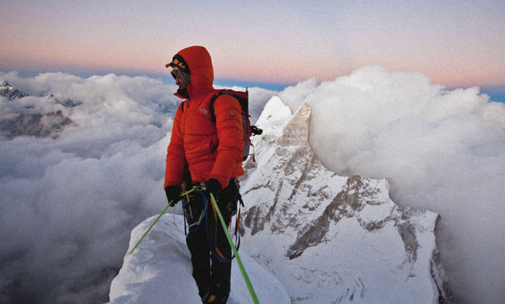 Jimmy Chin on the top of a mountain