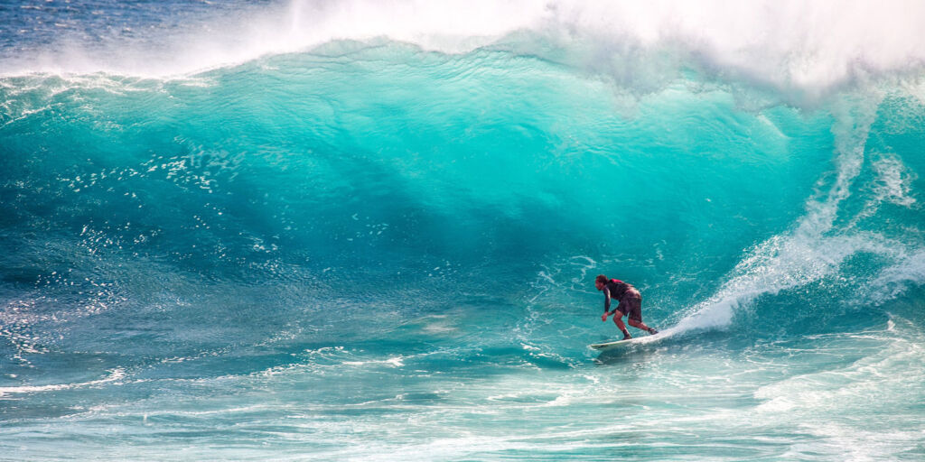 A surfer experiencing some big waves