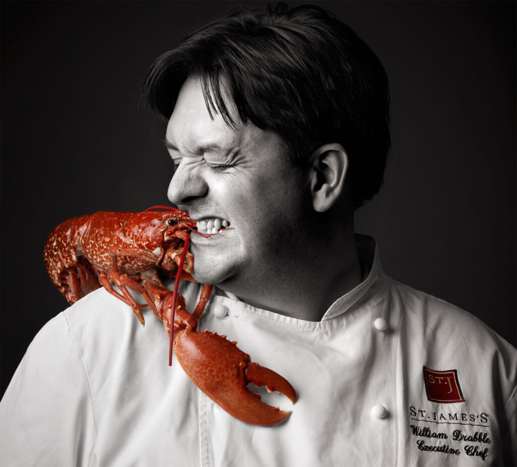 Chef William Drabble making friends with a lobster