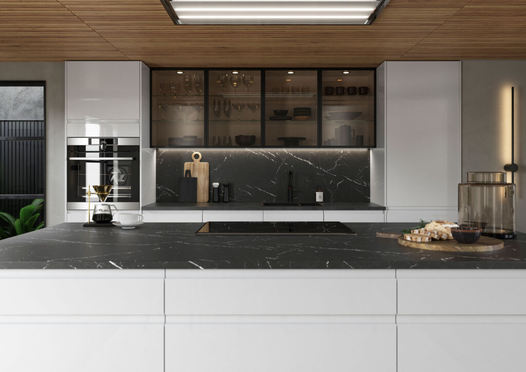 A black granite worktop in a kitchen