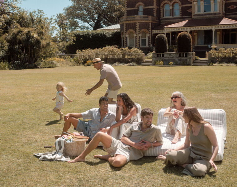 A family using one of the double lilos in the garden