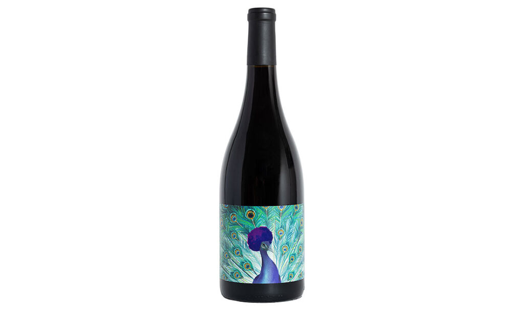 A bottle of the McBride sisters Reserve Pinot Noir 2018 with a peacock label