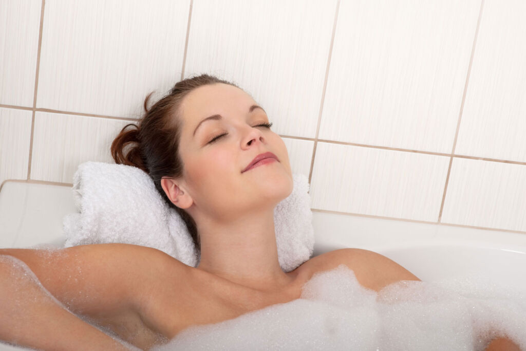 A woman enjoying a warm bath