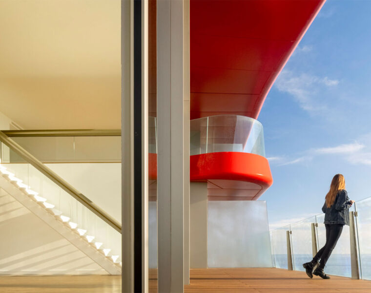 A woman standing on a balcony at Antares