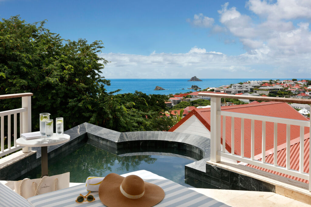 One of the luxury suites with an outdoor spa pool and amazing views across the island