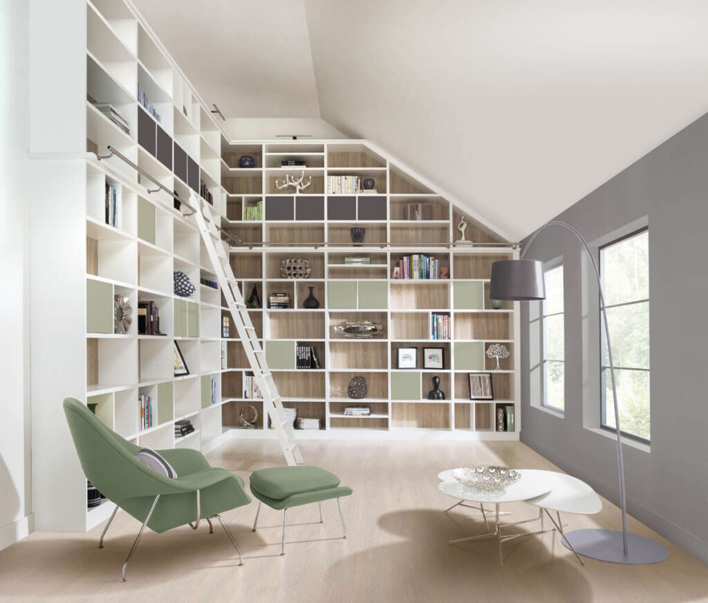 A room with built in shelving from floor to ceiling