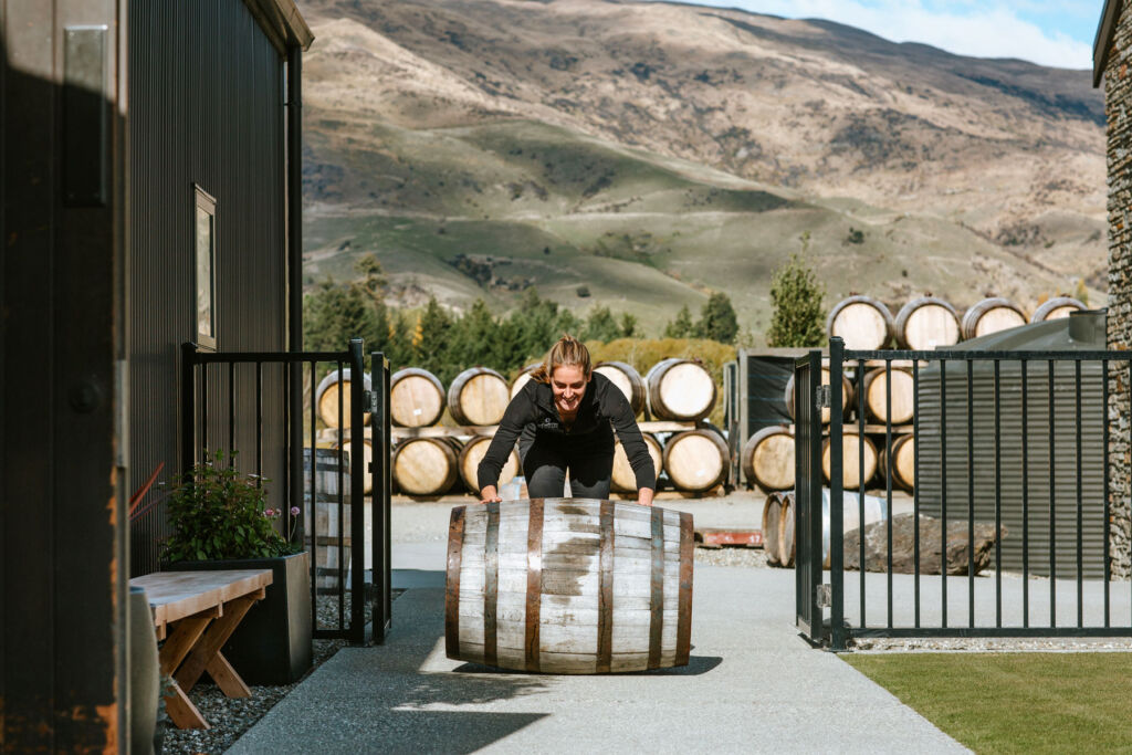 Rolling the barrels at the Cardrona Distillery