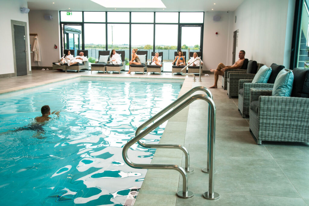 Guests enjoying the heated indoor swimming pool