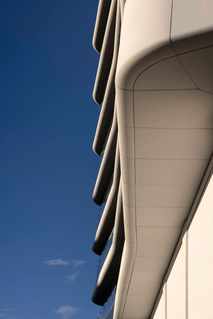 A close up view of the curved underside of the balconies