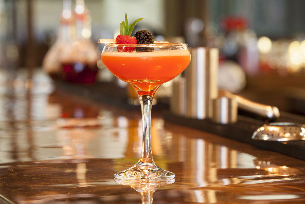 A cocktail sat on the restaurant bar