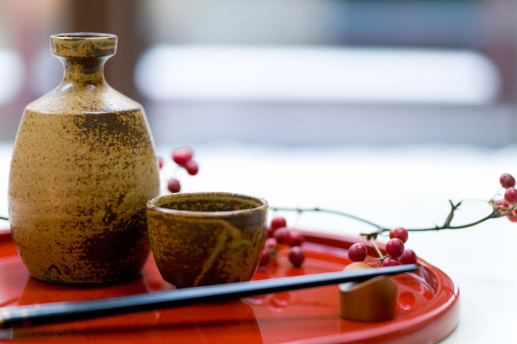 Traditional Sake on a tray with berries