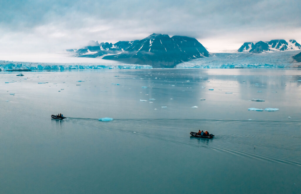 Guests exploring the icy waters of Svalbard in dinghy's
