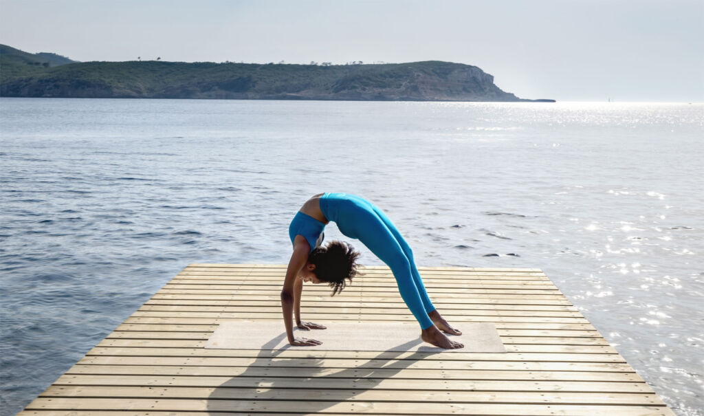 A woman exercising on the yoga pontoon